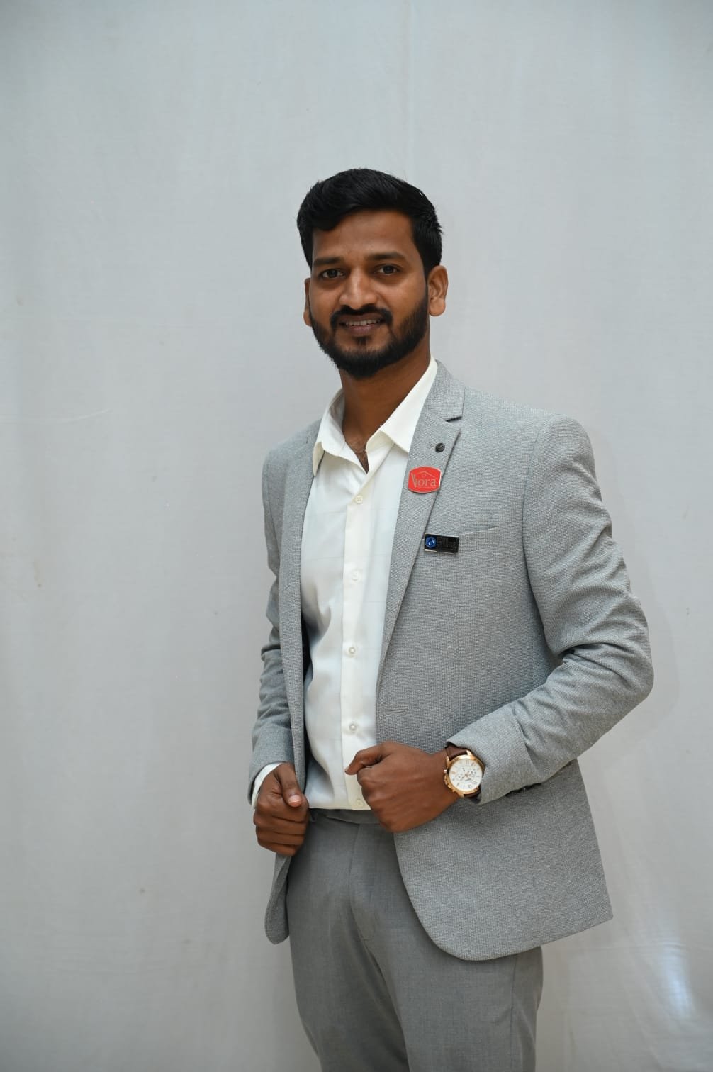 Saroj Sethy wearing Realtors Association of Odisha lapel pin